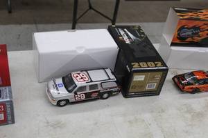 lot 875 image: Kevin Harvick #29 GM Goodwrench Service 2002 Chevrolet Slammed Suburban 124-Scale 1 of 4428 Limited Edition Diecast Adult Collectible  by  Action Racing Collectibles