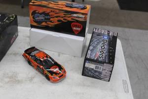 lot 876 image: Chevy Rock & Roll 400 Program Car 2003 Chevrolet Monte Carlo Stock Car 124-Scale 1 of 3624 Limited Edition Diecast Adult Collectible  by  Action Racing Collectibles