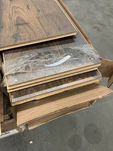 lot 112 image: 152 SF Premium Water Resistant Laminate Flooring Slightly Damaged on the end.