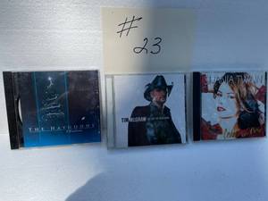 lot 23 image: The Haygoods CD-Tim McGraw (Live Like You Were Dying). Shania Twain CD