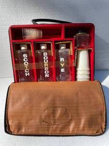 lot 37 image: Vintage Wooden Box With Plaid Zippered Cover. Includes Glass Scotch, Bourban, Rye Bottles, Plastic Shot Glasses & Drink Glasses