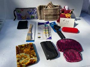 lot 39 image: NEW Hand Can Opener, New Pastry Brush, Make Up Cases, Elle Eye Glass Case And Knitted Toilet Paper Holder, Corn Holders
