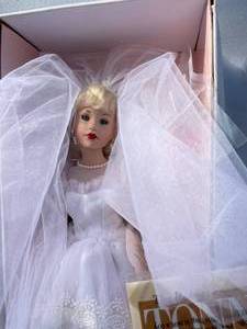 lot 78 image: Porcelain Doll By Kitty Collier Collections. Pink Dress With White & Purple With Pearls. Never Been Out Of Original Box