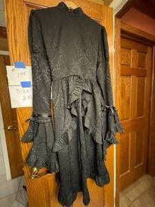 lot 145 image: Black Dress, Once Used For A Halloween Wedding Dress Size 2XL. Ties In Back. Fluffy top Sleeves, Silk Skirt. By Victorian Choice.