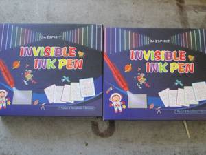 lot 297 image: 27 packs of invisible ink pens ...