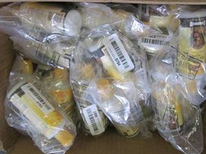 lot 408 image: box of burts bees paw and nose lot...
