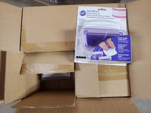 lot 18 image: Pallet of 864 New Wilton Sugar Sheets Border Punch Set with Scallops - Retail value $11,223