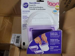 lot 24 image: Pallet of 300 New Wilton Sugar Sheets Border Punch Set with Oval Insert - Retail value $3,897