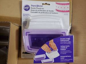 lot 21 image: Pallet of 432 New Wilton Sugar Sheets Border Punch Set with Scallops - Retail value $5,611