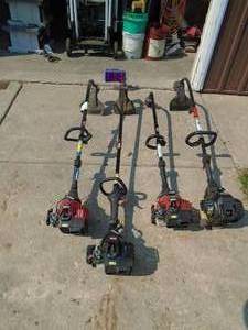 Lot of 4 gas weed trimmers. Probably need carb adjustment. As shown.