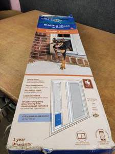 lot 1380 image: Open Box PetSafe Sliding Glass Pet Door - Dogs up to 40# - Fits Sliding Glass Doors from 76-1316 to 81 - Model PPA11-14767 - NO SHIPPING