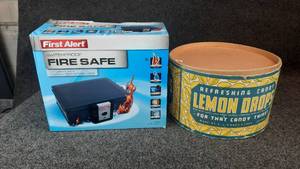 lot 1153 image: New First Alert Fire Safe & 13 diameter X 8 high Lemon Drop Cardboard Container