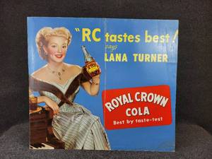 lot 1113 image: Vintage Lana Turner RC Cola Advertisement - Measures 29-12 W x 26-14 H