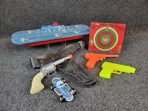 lot 1127 image: Vintage Toy Lot - Wolverine Stamped Steel Aircraft Carrier - Measures 18-12 L x 6-14 W x 3-12 H, Cap Gun, Squirt Guns, BUDDY L Race Car, and More