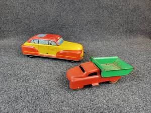 lot 1129 image: Vintage Tin Litho Wolverine Pull Back Friction Taxi Cab - Measures 13 L x 4-12 W x 4-12 H Vintage Steel Dump Truck - Measures 9 L x 4 W x 3-12 H