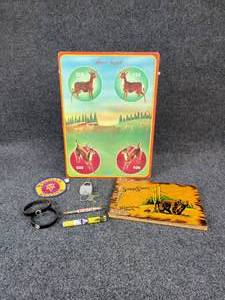 lot 1130 image: Vintage Tin Wyandotte Deer Target, Civil Defense Radiation Dosimeter, Yellowstone Park Photo Album, and MORE