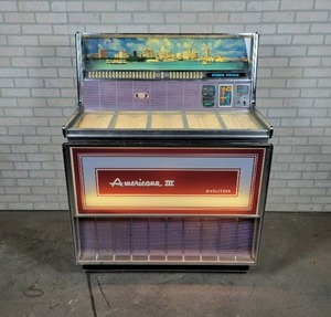lot 1005 image: Vintage Wurlitzer Americana III Jukebox with Keys, Model 3300 - Turns On and Lights Up Measures 40 W x 53 H x 24 D - NO SHIPPING