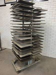 lot 1252 image: Vintage Rolling Bakers Rack w (33) Glazed Sheet Pans (35 x 17) - Rack is Overall about 84 x 42 x 35 -  From Veiths Bakery in St. Peter, MN - NO SHIPPING