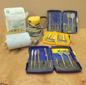 lot 31 image: DeWalt Random Orbit Palm Sander, Box of 80 Grit Sanding Discs and Assorted Drill Bits