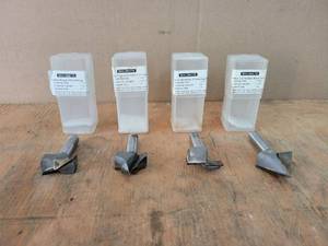 lot 128 image: (4) MAGNATE 12 Shank Router Bits