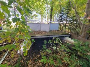 lot 4 image: Pontoon Boat - NO TITLE - 24 long x 8 wide, 20 long deck. Includes 70 HP Evinrude Outboard Motor - NO SHIPPING