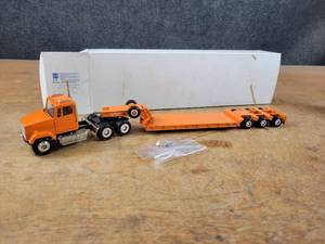 lot 1638 image: Freightliner Conventional Semi w Lowboy Trailer Diecast Model - 150 Scale - Conrad Model 3812
