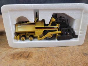 lot 1685 image: Caterpillar AP-1000 Asphalt Paver Diecast Model - 150 Scale - NZG Model 3881 - Official Launch Edition #312 of 2500