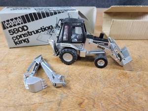lot 1704 image: Case 580D Construction King Backhoe Loader Diecast Model - Limited Silver Edition - 135 Scale - Made in Western Germany