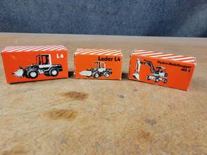 lot 2695 image: (3) O&K Diecast Models - L6 Wheel Loader (NZG 381), L4 Wheel Loader (NZG 278) and MH2 Wheeled Excavator (NZG 287)