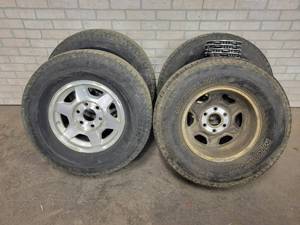 lot 131 image: (4) Michelin P26570R16 Tires and Aluminum Rims - 6x5.5 Bolt Pattern - Include (4) GMC Center Caps - NO SHIPPING