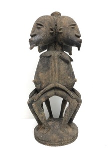 Early Carved Multi-Headed Seated Figure