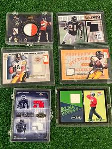 lot 95 image: Football Jersey Cards - Kordell Stewart, LaDainian Tomlinson, Cade McNown, Larry Johnson