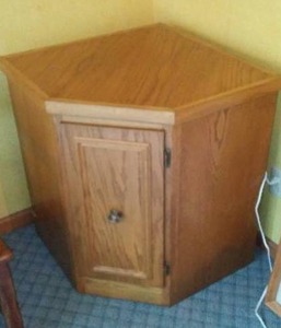 lot 9 image: Corner Oak Table Cabinet.