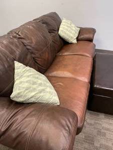 lot 4 image: Faux Leather Couch with Storage Ottoman