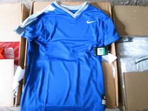 lot 28 image: Box of Nike girls softball jerseys ...