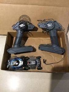 lot 99 image: Two Remote Control cars - Air Hogs