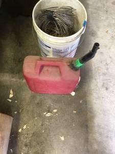 lot 115 image: Tire Chains, Gas can and steel wire