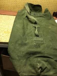 lot 175 image: lots of License plates and Military duffle bag