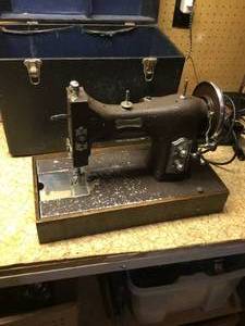 lot 225 image: Domestic Rotary sewing machine case and extras