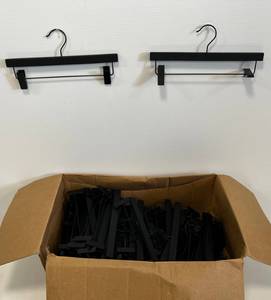 Group Of Black Wood Pant Hangers