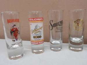 lot 46 image: 11 SHOOTER SHOT GLASSES - APPROX 4 18 - BEEFEATER,GOLDSCHLAGER, SAUZA, KAHLUA, STOLI, MALIBU, STOLICHNAYA - VERY COOL SET - SEE PICTURES