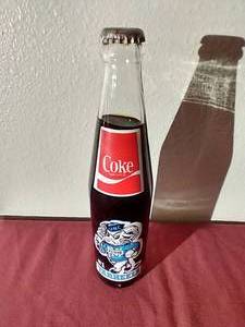 lot 124 image: Full 1981-82 UNC National Basketball Champions Coke Bottle