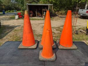 lot 31 image: (3) Large Orange Safety Cones and (1) Small Orange Safety Cone