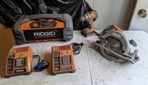 lot 121 image: Rigid Power Tools Drill, Saw, Chargers, and Radio