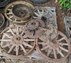 lot 175 image: Stack of Vintage Wheels with Wooden Spokes and Metal Rims, Some Rims Only