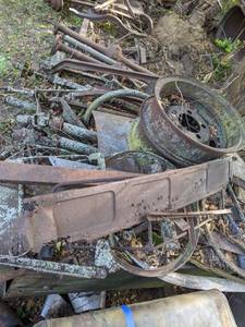 lot 367 image: Large Array of Vintage Automotive Parts, Axles, Rims, and More
