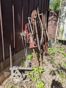 lot 303 image: Assortment of Shovels, Hand Pump, Scythe, Chain Wrench, Saw and More