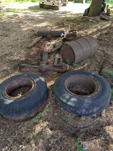 lot 310 image: Vintage Vehicle Fuel Tank, Tires, Radiator, Axle, Metal Drum and More