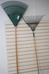 lot 71 image: Two green leaf rakes