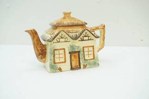 lot 131 image: House shaped teapot